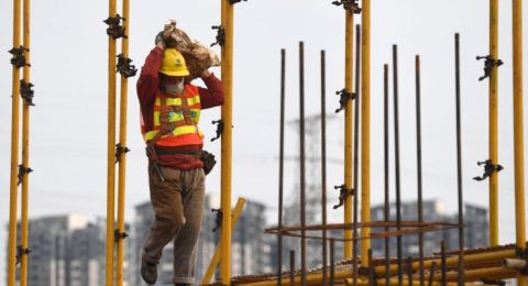 Nanning, China's Guangxi Zhuang Autonomous Region. 21st Feb, 2020. A laborer works at a construction site in Nanning, capital of south China's Guangxi Zhuang Autonomous Region, Feb. 21, 2020. Construction industry has gradually resumed amid strict prevent